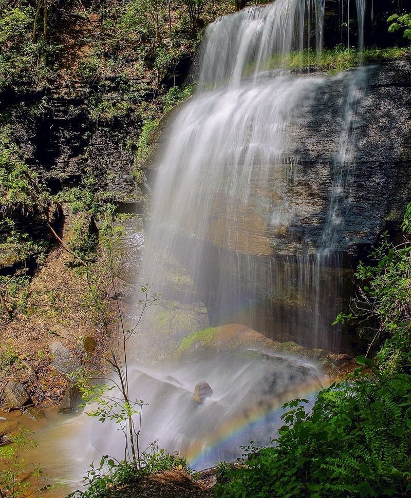 Water descending through ancient stone, the mountain exhaling